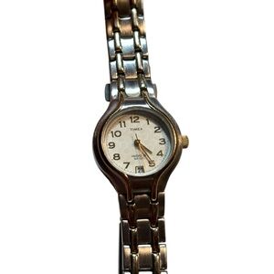 vintage Timex Indiglo ladies' quartz watch with a two-tone case and bracelet